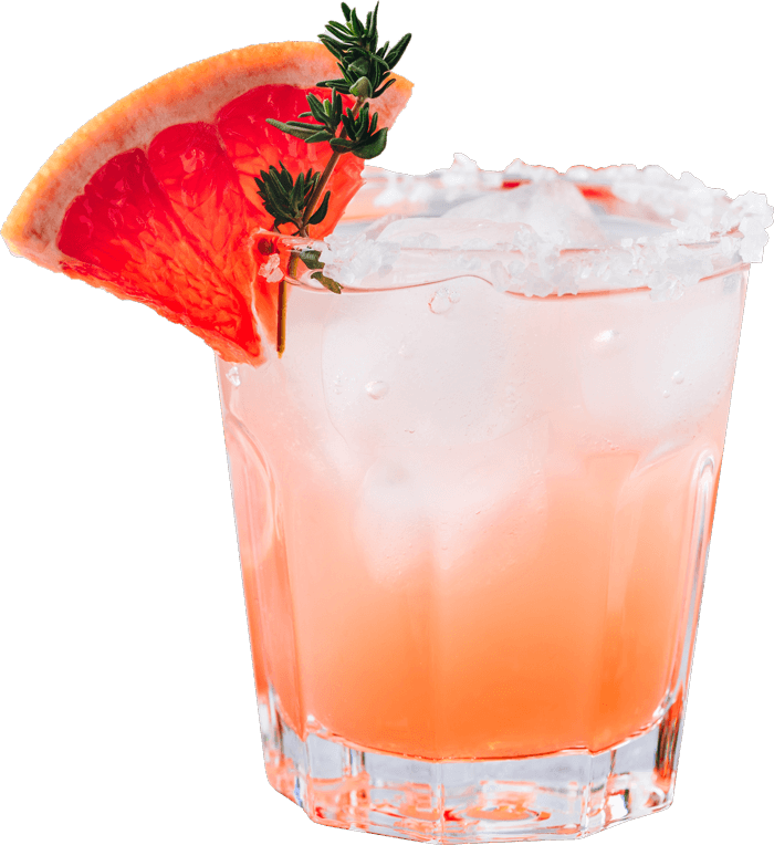 A scrumptious pink margarita in a rocks glass garnished with fruit.